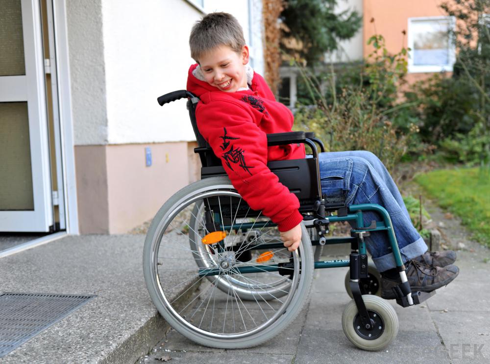 boy in wheelchair at step