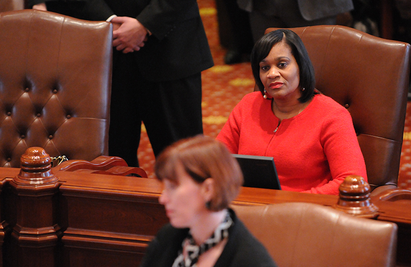 Sen. Kimberly A. Lightford (D-Maywood) listens to Sen. Heather Steans (D-Chicago) during debate about Senate Bill 10, the Religious Freedom and Marriage Fairness Act, on Feb. 14 at the Capitol.